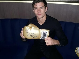 Luke with one of his signed gloves